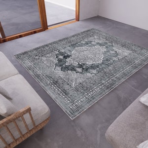 May include: A grey and white patterned rug with a distressed look. The rug is placed in a modern living room setting with two sofas.