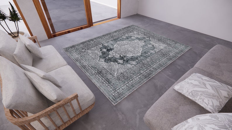 May include: A grey and white patterned rug with a distressed look. The rug is placed in a modern living room setting with two sofas.