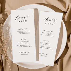 May include: Two white cards with black text on a beige background. The cards are wedding menus for Laura and Chris. The menus list starters, main courses, and desserts.