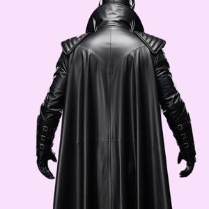 May include: A black leather coat with a high collar and cape-like design. The coat features quilted shoulder pads and is worn with matching gloves. The back view showcases the coat's sleek, streamlined silhouette.