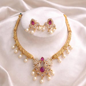 Kundan Ruby Peacock Hasli Necklace Set: Indian Jewelry with Pearl Drops