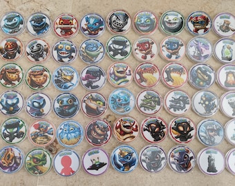 May include: A collection of 48 Skylanders Imaginators character tokens. The tokens are round and feature various colourful characters with different designs.