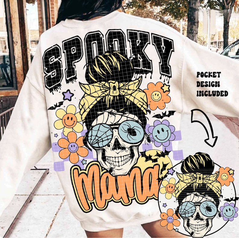 May include: White sweatshirt with a graphic print of a skull with a messy bun, wearing sunglasses and a headband. The text "Spooky Mama" is printed in orange and black. The text "Pocket Design Included" is printed in black on the right side of the sweatshirt.