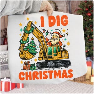 May include: White Christmas-themed pillowcase with a cartoon excavator driven by Santa Claus. The excavator's bucket holds a small Christmas tree, and the text "I DIG CHRISTMAS" is printed in orange.