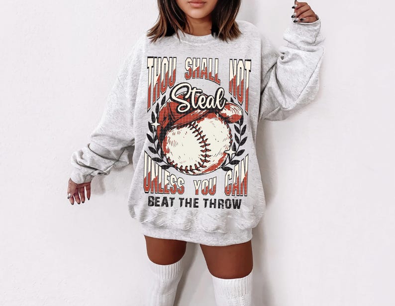 May include: Gray sweatshirt with a baseball graphic and the text "Thou Shall Not Steal Unless You Can Beat The Throw".