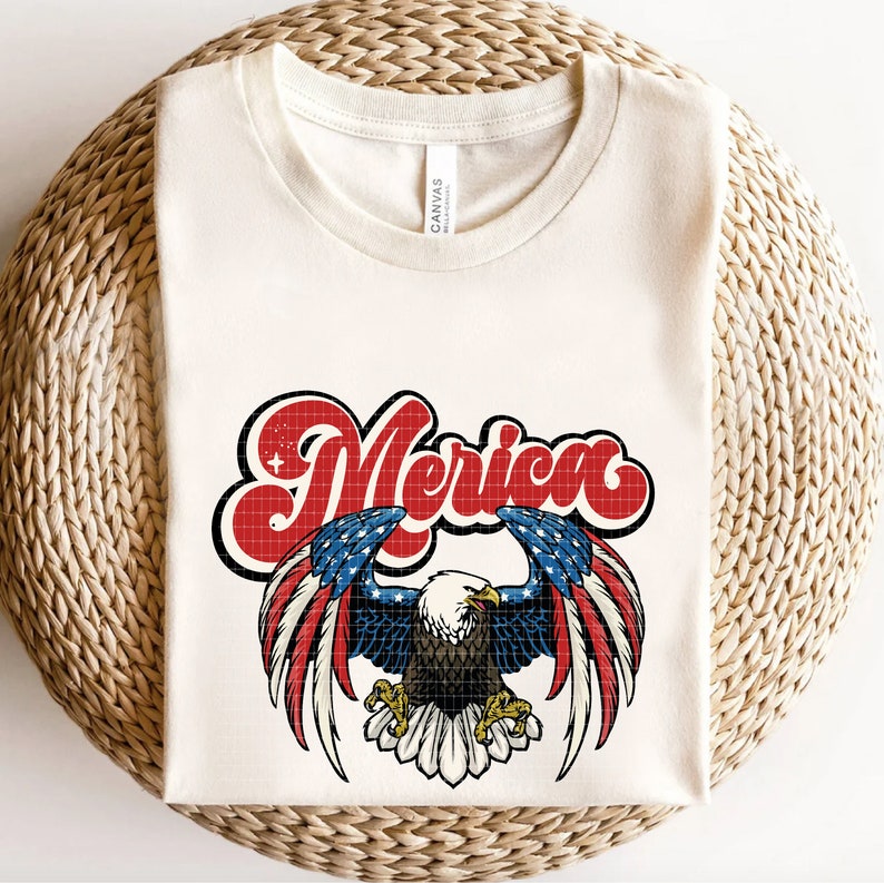 May include: A white t-shirt with a red, white, and blue American flag design featuring an eagle with the word "Merica" in a retro font.