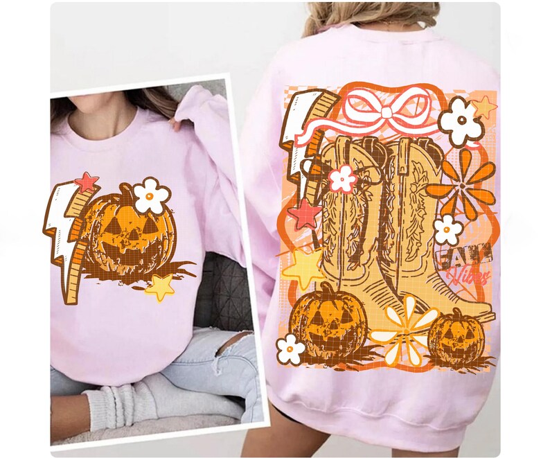 May include: A light pink sweatshirt featuring a pumpkin graphic with a lightning bolt and flower. The back of the sweatshirt has a design with cowboy boots, pumpkins, flowers, and the text "Fall Vibes".
