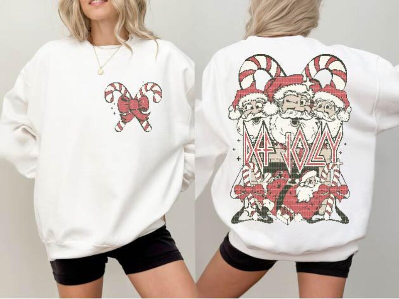May include: White sweatshirt with a red and white candy cane design on the left side and a Christmas-themed graphic on the right side. The graphic features three Santa Clauses with the text "Eat Jolly" in a bold font.