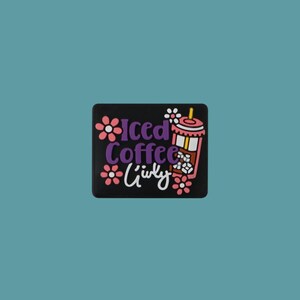 May include: Black and white sticker with a pink and white iced coffee cup with a straw and ice cubes. The text "Iced Coffee" is in purple and the text "Girly" is in white.