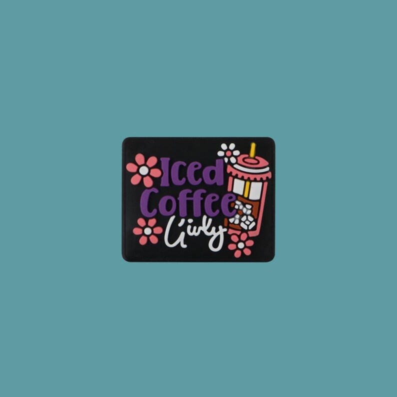May include: Black and white sticker with a pink and white iced coffee cup with a straw and ice cubes. The text "Iced Coffee" is in purple and the text "Girly" is in white.
