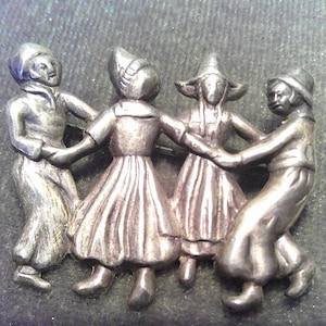 Vintage sterling Dutch boy and girl dancing pin broach