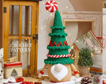 May include: A handmade crochet Christmas gnome with a green tree-shaped hat and a red and white peppermint candy on top. The gnome has a beige body, a white beard, and red accents. The text "CROCHET PATTERN" is visible.