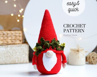 May include: Crochet pattern for a Christmas gnome. The gnome is red with a white beard and a green holly wreath on its head. The pattern is easy and quick to follow.