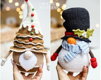 May include: Two crocheted Christmas ornaments, a gingerbread gnome and a snowman. The gnome is wearing a brown and white gingerbread hat with red and green candy decorations. The snowman is wearing a black top hat with a green holly sprig and a blue scarf.