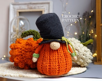 May include: A set of crochet patterns for making three autumn-themed gnomes. The gnomes are dressed in orange, black, and white, and are holding pumpkins. The text "SET CROCHET PATTERN" is visible in the image.