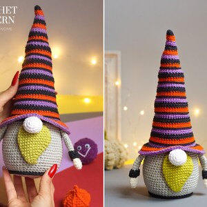 May include: A crocheted Halloween gnome with a purple, orange, and black striped hat. The gnome has a gray body, a yellow beard, and a white nose.