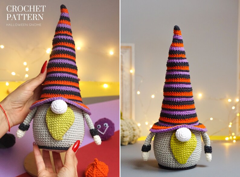May include: A crocheted Halloween gnome with a purple, orange, and black striped hat. The gnome has a gray body, a yellow beard, and a white nose.