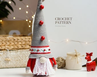 May include: Crochet pattern for a Christmas gnome. The gnome is gray and red with a white beard and a red hat with white trim. The hat has three red pom-poms. CROCHET PATTERN Christmas Gnome.