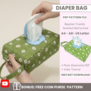 May include: A green diaper bag with a daisy pattern, featuring a blue dispenser for wipes. The bag has a handle and is rectangular. Text on the image reads "DIAPER BAG" and "PDF PATTERN FILE".