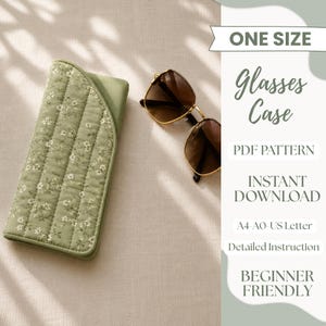 May include: A sage green quilted glasses case with a white floral pattern next to brown sunglasses. The text reads: ONE SIZE, Glasses Case, PDF PATTERN, INSTANT DOWNLOAD, A4-A0-US Letter, Detailed Instruction, BEGINNER FRIENDLY.