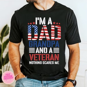 May include: Black t-shirt with a red, white, and blue American flag design. The text "I'm a Dad Grandpa and a Veteran Nothing Scares Me" is printed on the shirt.