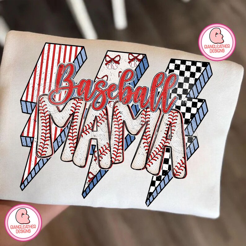 May include: White t-shirt with the words "Baseball MAMA" in red script. The letters are filled with baseball stitching and are set against a lightning bolt design with red and white stripes, blue accents, and a black and white checkered pattern.