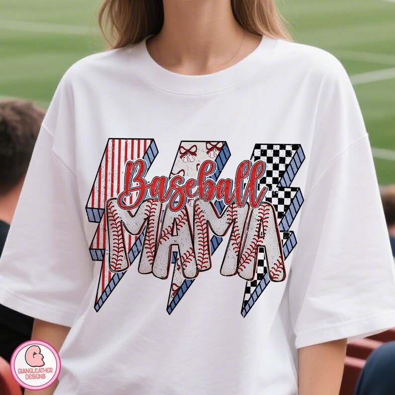 May include: White t-shirt with the text "Baseball Mama" in red script. The text is inside three lightning bolt shapes with red and white stripes, baseball stitching, and a black and white checkered pattern.