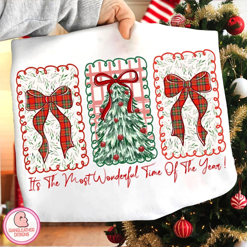 May include: White Christmas-themed fabric with three rectangular designs. Each design features a red plaid bow or a green Christmas tree with red ornaments. The text "It's The Most Wonderful Time Of The Year!" is written in red.