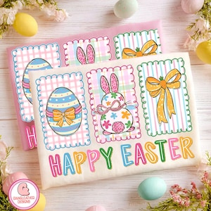 May include: Two Easter-themed shirts with colorful designs. One shirt is pink, the other is off-white. Each features three framed illustrations: an Easter egg, a bunny, and a bow. The words "HAPPY EASTER" are printed in colorful letters across the bottom.