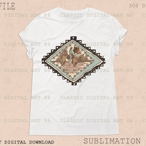 May include: A white t-shirt with a colorful geometric design featuring a cowboy riding a horse. The design is in a diamond shape with brown, blue, and white colors.