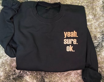 Sí. Claro. Vale. Sudadera de cuello redondo con bailarinas enrollando el felpudo de bienvenida. Sorprendida.