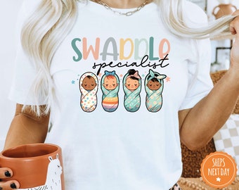 Swaddle Specialist T-shirt | Labor And Delivery Shirt | NICU Nurse Shirt | Neonatal ICU Registered Nurse | Nursing Outfit | Comfort Colors