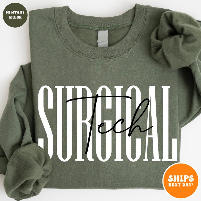 May include: A military green sweatshirt with the text "SURGICAL Tech" in white letters with a black outline.