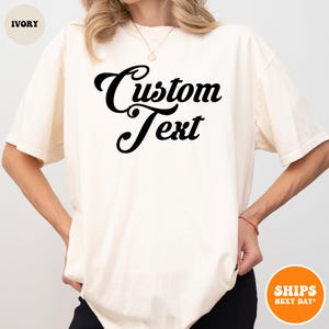 a woman wearing a t - shirt that says custom text