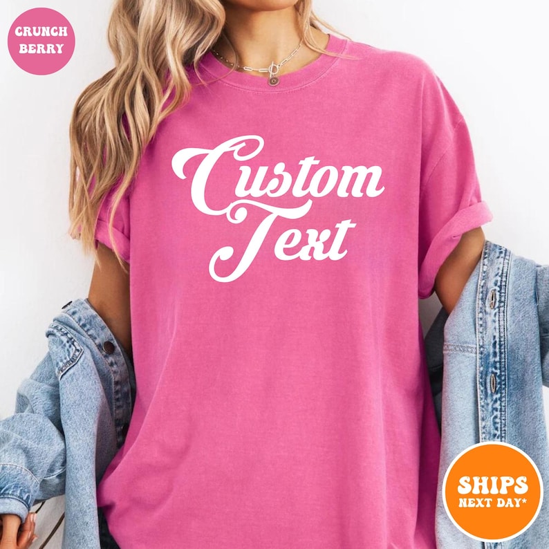 a woman wearing a pink shirt that says custom text