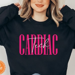 May include: Black sweatshirt with the text "CARDIAC Tech" in pink lettering.