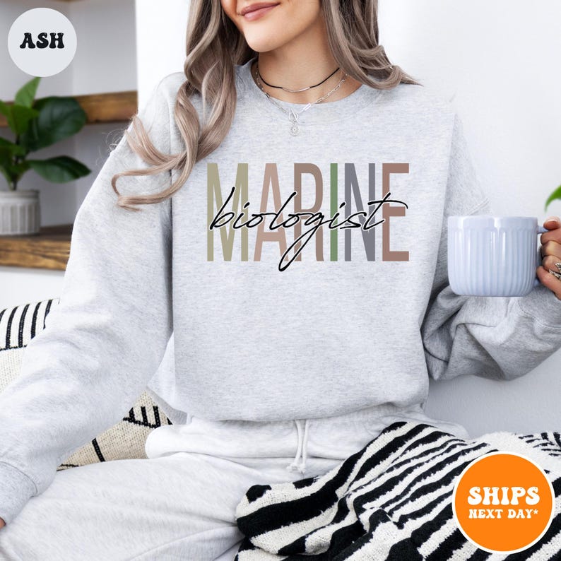 a woman sitting on a couch holding a coffee mug