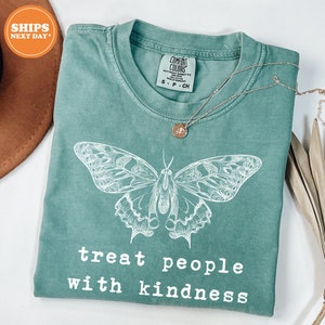 a t - shirt with a picture of a butterfly on it