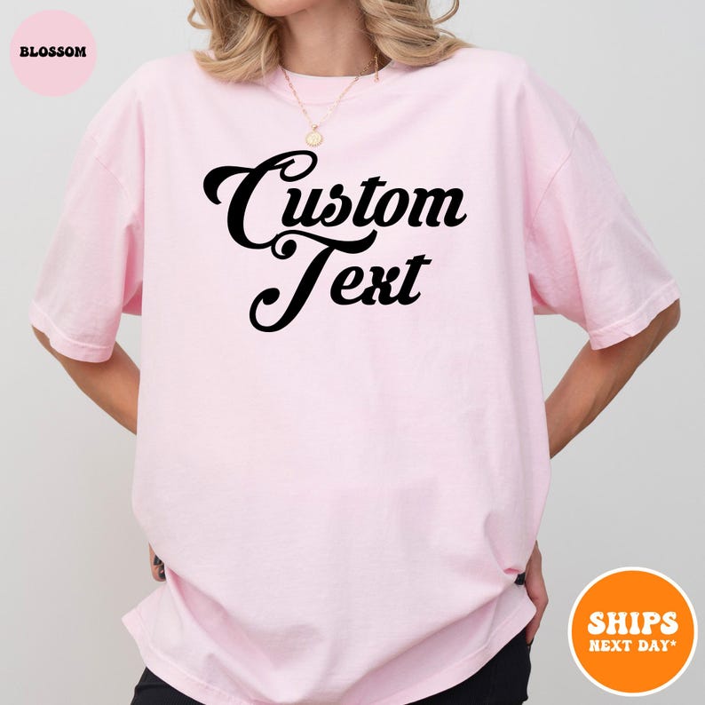 a woman wearing a pink shirt that says custom text