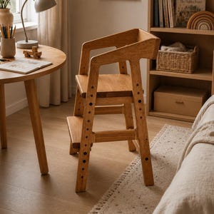 May include: A light brown wooden high chair with a tall backrest, a flat seat, and a lower footrest. The side frames feature a series of circular holes for height adjustment. The chair has a sturdy four-legged base and a natural wood grain finish.