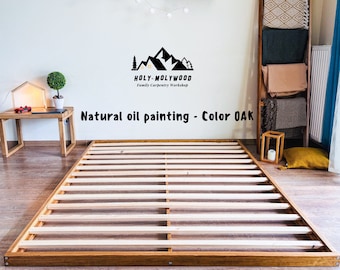 Japans peuterbed op tatamivloer, houten montessoribed