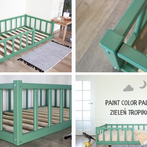 May include: A green wooden toddler bed with a removable side rail. The bed is shown in a room with a rug and a dinosaur toy. The text "PAINT COLOR PALETTE ZIELEN TROPIKOW" is visible on the wall.
