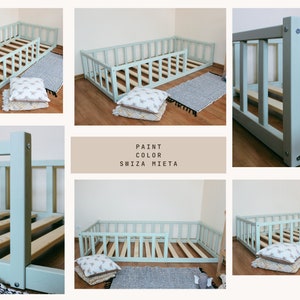 May include: A light blue wooden toddler bed with a removable safety rail. The bed has a slatted base and is shown with pillows and a rug.