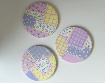 Pastel hand painted patchwork coasters.