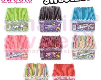 May include: Assortment of 100 count sweetzone candy pencils in various flavors: apple, blackcurrant, raspberry, bubblegum, cherry, rainbow, and strawberry. Each flavor is in a clear plastic container with a colorful label.