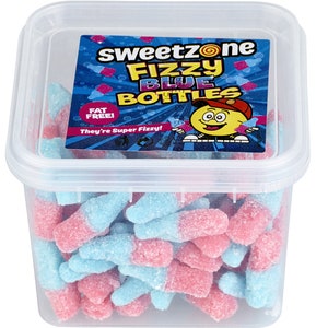 May include: A clear plastic container filled with fizzy blue and pink candy shaped like bottles. The container has a label that reads "sweetzone Fizzy Blue Bottles" with a cartoon character. The candy is labeled "Fat Free!"