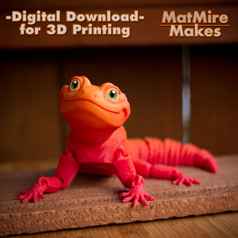 May include: A 3D printed articulated lizard figurine in a vibrant orange and red gradient. The text -Digital Download- for 3D Printing and MatMire Makes is visible at the top. The lizard has large green eyes and a segmented tail structure.
