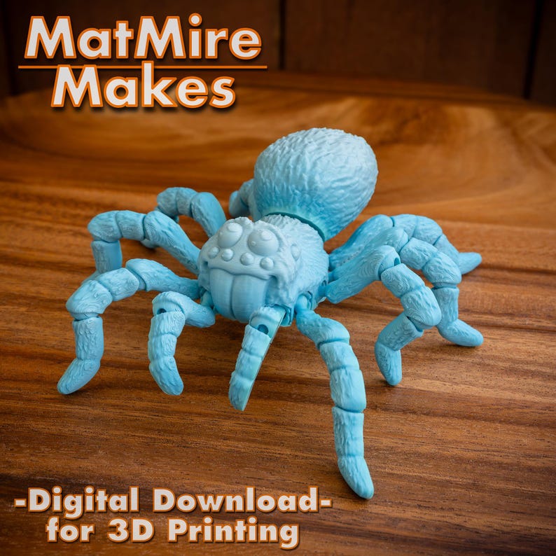May include: A light blue 3D printed model of a spider with articulated legs. The spider has large, round eyes and a textured body. The model is posed on a wooden surface.  -Digital Download- for 3D Printing
