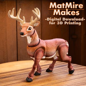 May include: A brown and white articulated deer figurine with large antlers. The text MatMire Makes -Digital Download- for 3D Printing is visible in the upper right corner. The deer has a tan face, white throat, and black hooves.