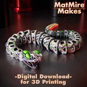 May include: A segmented toy snake with a detailed design, featuring a silver, gray, and green color scheme. The snake's head is open-mouthed, and the body is articulated. Text on the image reads "MatMire Makes" and "-Digital Download- for 3D Printing."